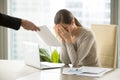 Sad depressed businesswoman gets document with bad news, company