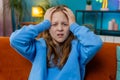 Sad depressed child girl at home looks pensive thinks over life concerns or study test exam fail Royalty Free Stock Photo