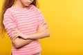 Sad depressed girl yellow background crossed arms Royalty Free Stock Photo