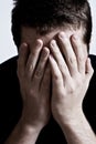 Sad depressed man with hands over face Royalty Free Stock Photo