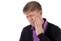 Sad depressed man in pain holding his cheek. Portrait of a man on white background. Emotion facial expression. Feelings