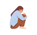 Sad depressed person in grief and despair. Unhappy upset woman in depression and frustration, sitting and hugging knees