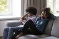 Sad depressed teenage Black boyfriend ignoring girlfriend, keeping silence Royalty Free Stock Photo