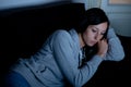 Sad depressed woman lying on the couch Royalty Free Stock Photo