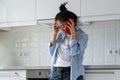 Sad depressed young Asian woman at home talking on phone, upset female calling psychologist Royalty Free Stock Photo