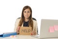 Sad desperate businesswoman in stress at office computer desk holding help sign Royalty Free Stock Photo