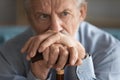 Sad disabled old man lot in thoughts at home Royalty Free Stock Photo