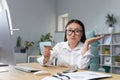 sad and disappointed asian woman trying to make a purchase in online store, business woman using phone and bank credit Royalty Free Stock Photo