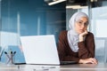 Sad disappointed woman in hijab looking at camera, businesswoman at workplace not satisfied with achievement results