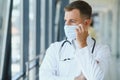 Sad doctor standing in hospital corridor Royalty Free Stock Photo