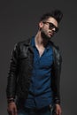 Sad and dramatic fashion in leather jacket and sunglasses Royalty Free Stock Photo