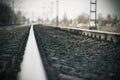 Sad dreary gray landscape with a railway going into the distance