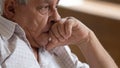 Sad elderly male look in distance mourning Royalty Free Stock Photo