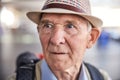 Sad elderly traveler gazing into the distance Royalty Free Stock Photo