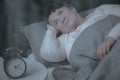Elderly woman trying to sleep