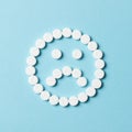 Sad face with white pills Royalty Free Stock Photo