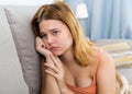 sad female on cozy sofa at home Royalty Free Stock Photo