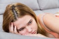 Sad female on cozy sofa at home Royalty Free Stock Photo