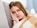 sad female on cozy sofa at home Royalty Free Stock Photo