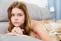 sad female on cozy sofa at home Royalty Free Stock Photo