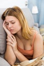 sad female on cozy sofa at home Royalty Free Stock Photo