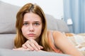 sad female on cozy sofa at home Royalty Free Stock Photo