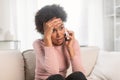 Sad frightened shocked frustrated millennial african american female, call and talk by smartphone, suffer from stress