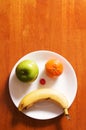 Sad Fruit Face Plate Royalty Free Stock Photo