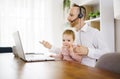 sad and frustrated father in kitchen home office with computer and her daugher