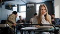 Sad frustrated insecure girl student sitting in classroom at desk suffering from abuse bad attitude ridicule from Royalty Free Stock Photo