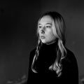 Sad girl on a background of an old wall Royalty Free Stock Photo