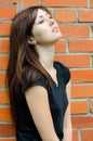 Sad girl at brick walls Royalty Free Stock Photo