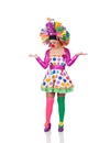 Sad girl clown with a big colorful wig Royalty Free Stock Photo