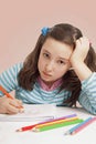 Sad girl drawing with color pencils Royalty Free Stock Photo