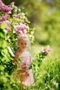 Sad girl lilac bushes. Spring blooming gardens Royalty Free Stock Photo