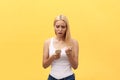 Sad girl looking at her damaged hair with comb in hand Royalty Free Stock Photo