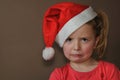 Sad girl in santa cap Royalty Free Stock Photo