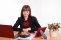 Sad girl sits at office table Royalty Free Stock Photo