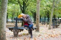 Sad girl sitting on a bench in park Royalty Free Stock Photo