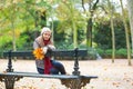 Sad girl sitting on a bench in park Royalty Free Stock Photo