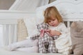 Sad girl with toy bear. Royalty Free Stock Photo