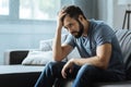 Sad gloomy man holding his forehead Royalty Free Stock Photo