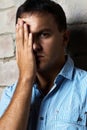 Sad guy against wall Royalty Free Stock Photo