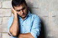 Sad guy against wall Royalty Free Stock Photo