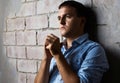 Sad guy against wall Royalty Free Stock Photo