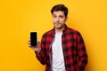 Sad guy holding showing empty smartphone screen Royalty Free Stock Photo