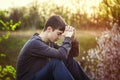 Sad guy sitting on the ground Royalty Free Stock Photo