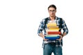sad handsome student holding stack of books and looking at camera Royalty Free Stock Photo