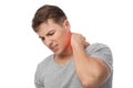 Sad handsome young caucasian guy suffer from neck pain, presses hand to sore spot, indicated in red