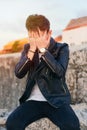 Sad handsome young man in the open air. Concept despair and depression Royalty Free Stock Photo